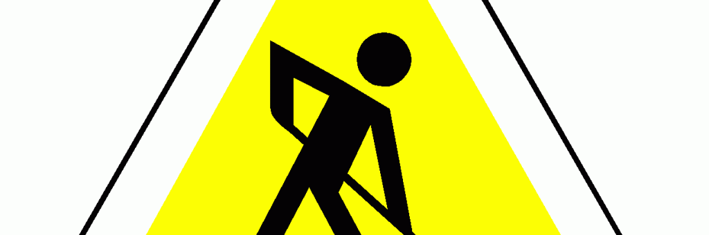 שלט - כאן בונים